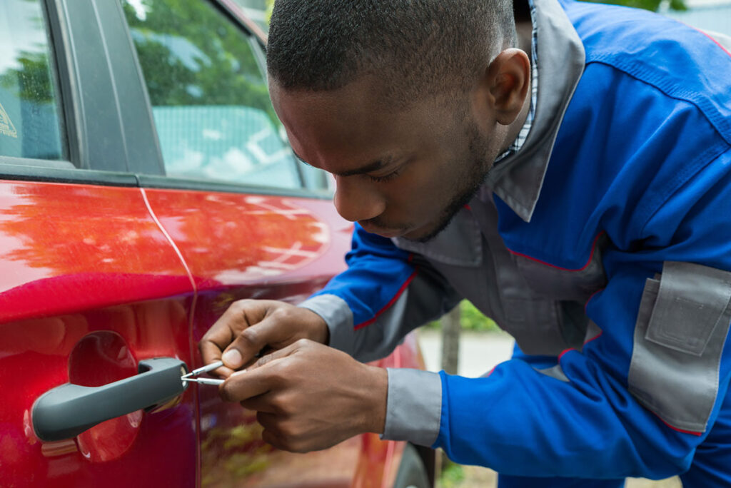 Locksmith unlocking locked car