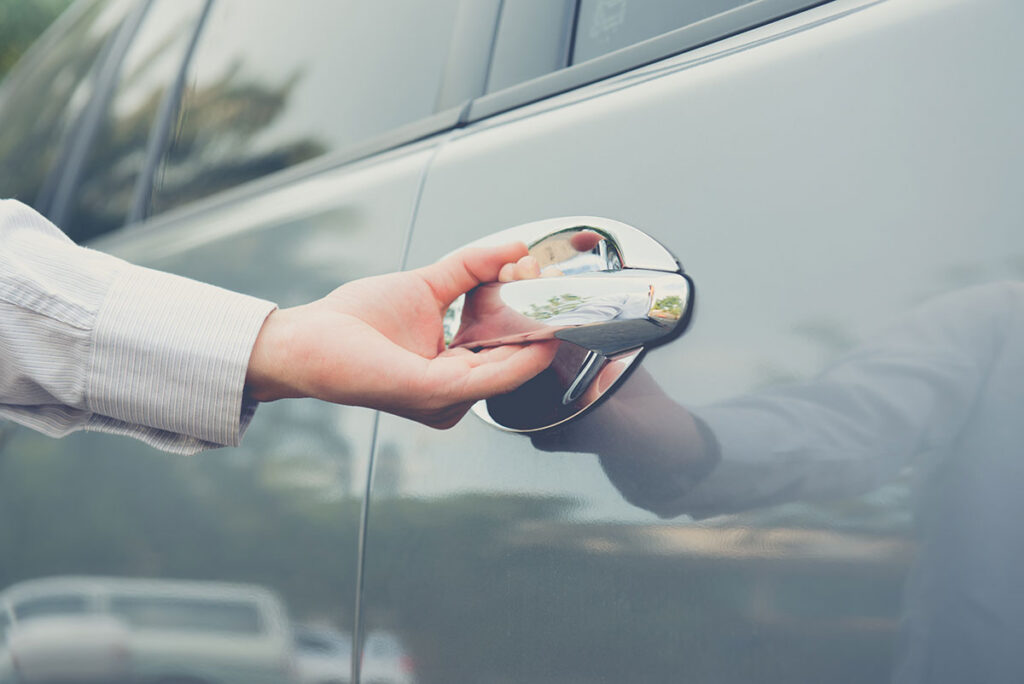 locksmith helping open a locked car